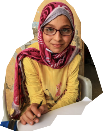 Young girl wearing glasses and writing on a piece of paper